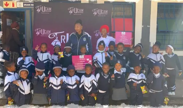Young learners gathered in front of the TruCam banner during the anti-bullying campaign