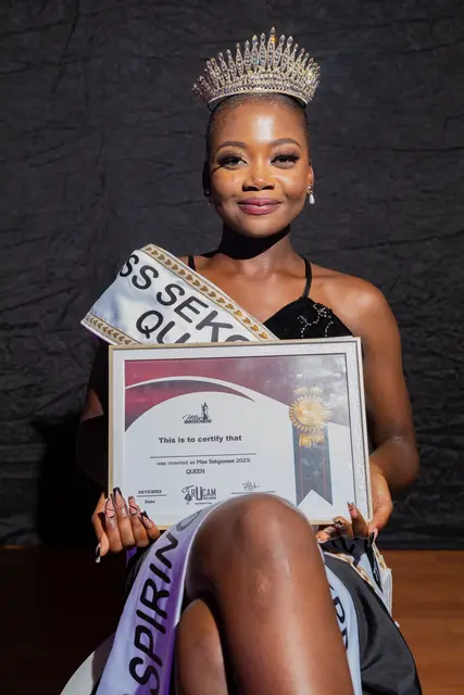 Miss Sekgosese Queen holding her certificate