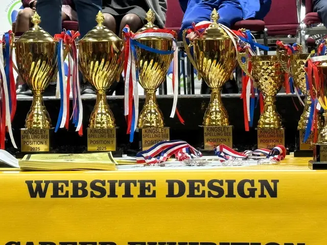 Trophies and medals lined up for the spelling bee winners